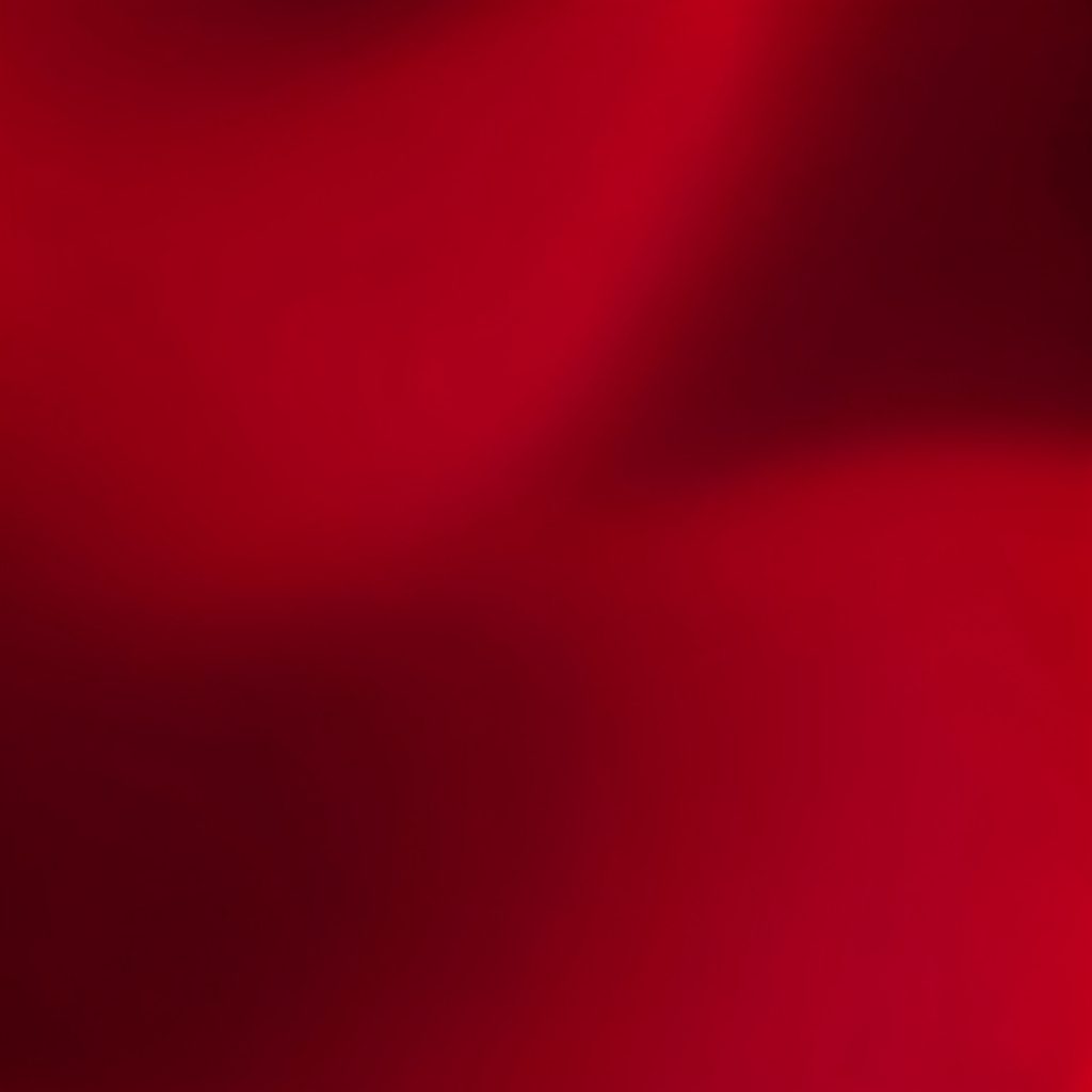 An abstract gradient from warm ochre to deep burgundy, rich and atmospheric.
